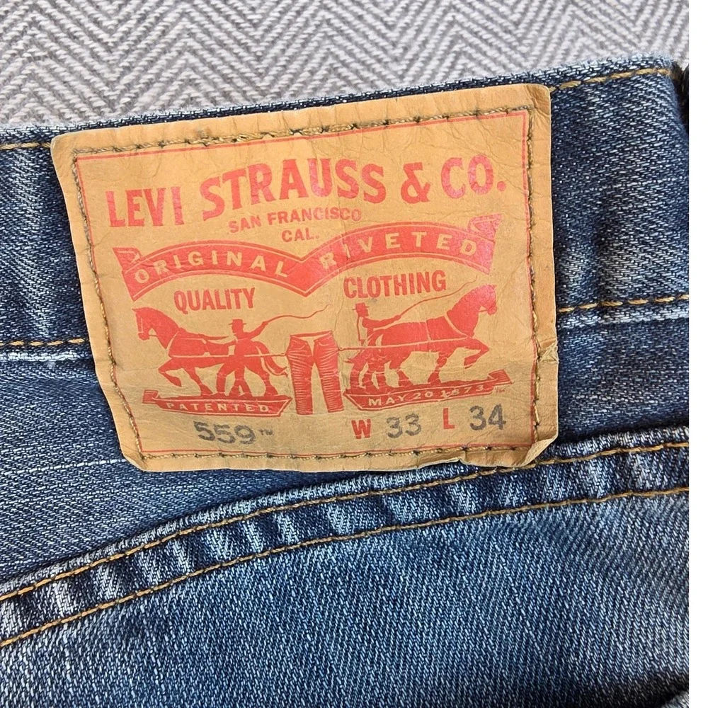 Levis 559 Relaxed Straight Jeans Mens 33x34 Medium Wash Blue Distressed Thrashed